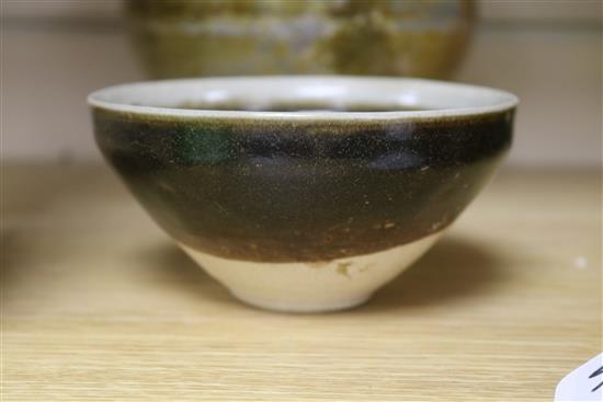 A Chinese green glazed jar, two other pottery jars and a pottery figure